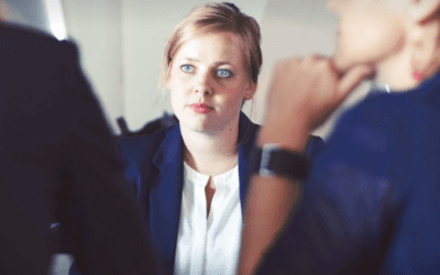 Woman attentively listening during office meeting