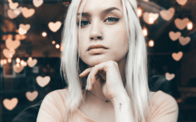 Blonde woman with nose ring, heart bokeh