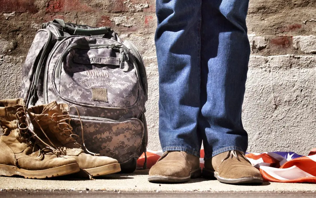 Military boots, backpack, and American flag