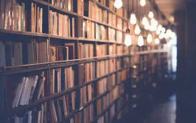 Cozy library aisle with hanging light bulbs