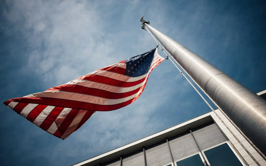 American flag flying on tall flagpole