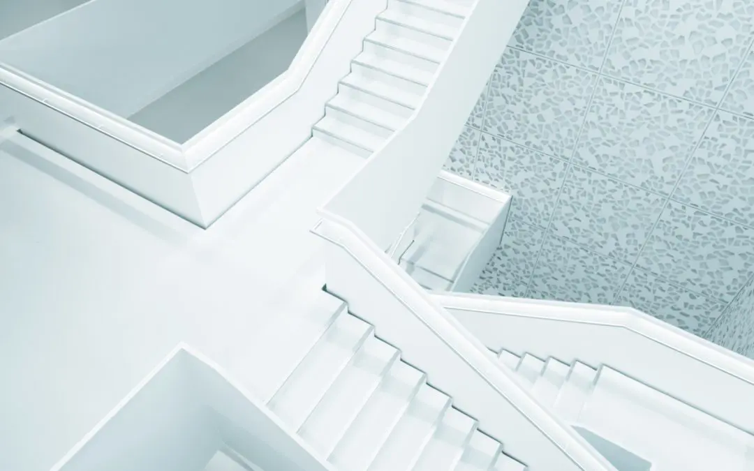 Top-down view of white geometric staircases