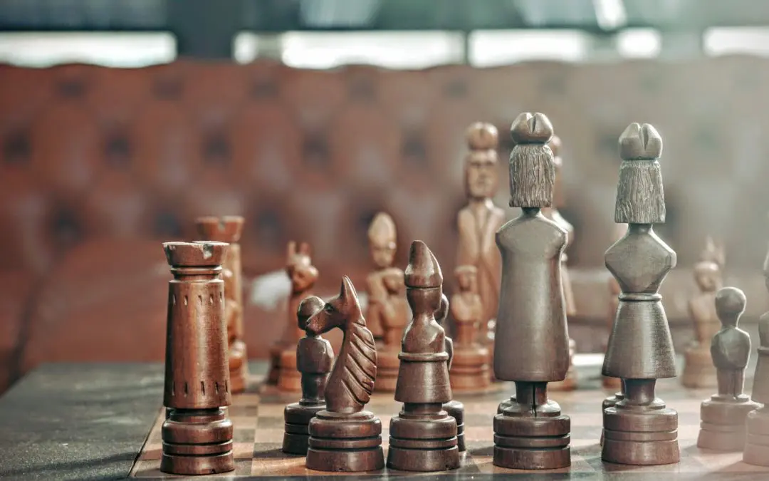 Close-up of wooden chess pieces on board