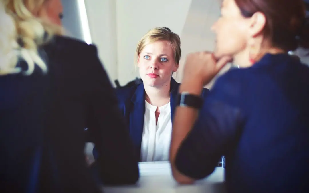 Woman attentively listening in business meeting