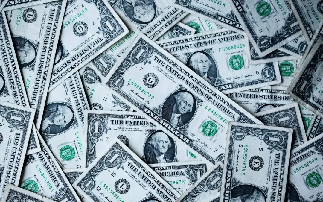 Pile of US one dollar bills