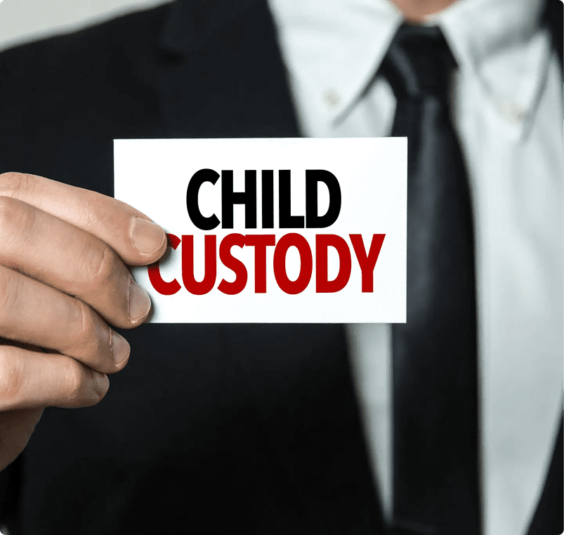 Man holding "Child Custody" card in suit.