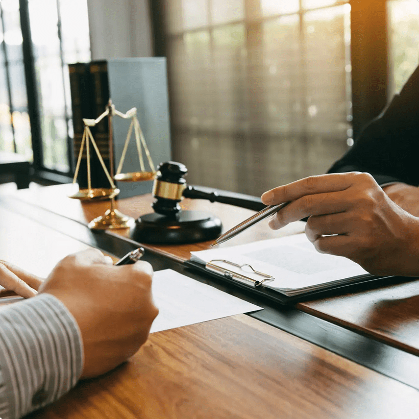 Legal consultation with scales and gavel.