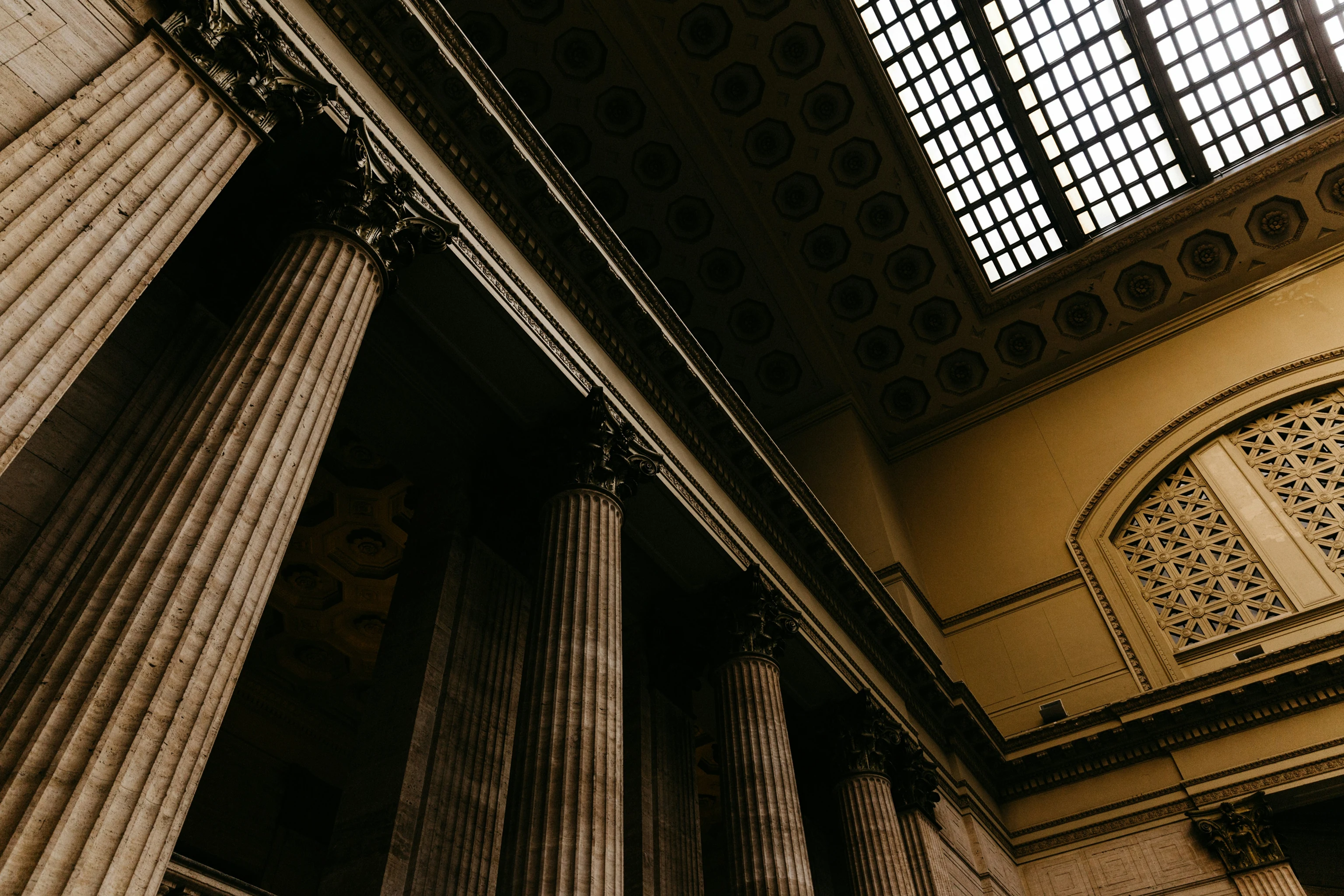 Tall classical columns and ornate ceiling skylight